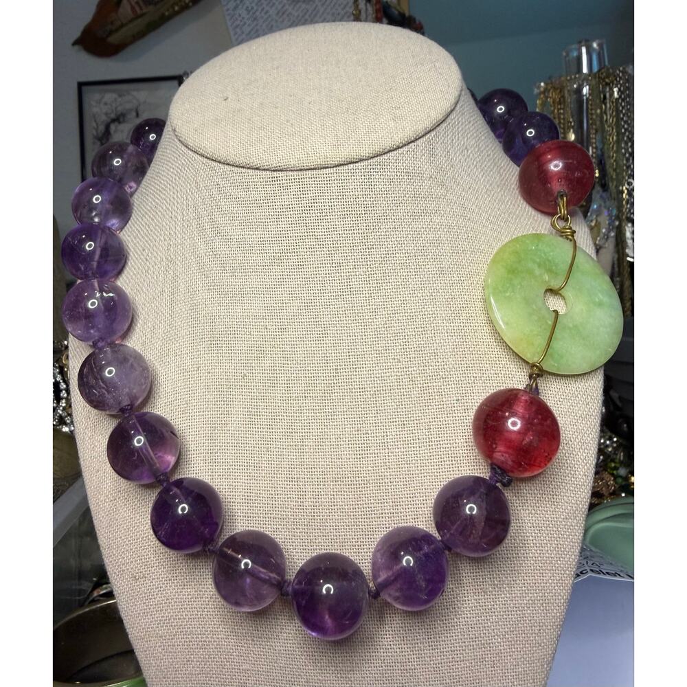 LargePolished Amethyst beads with a jadeite donut closure artisan made hand knot